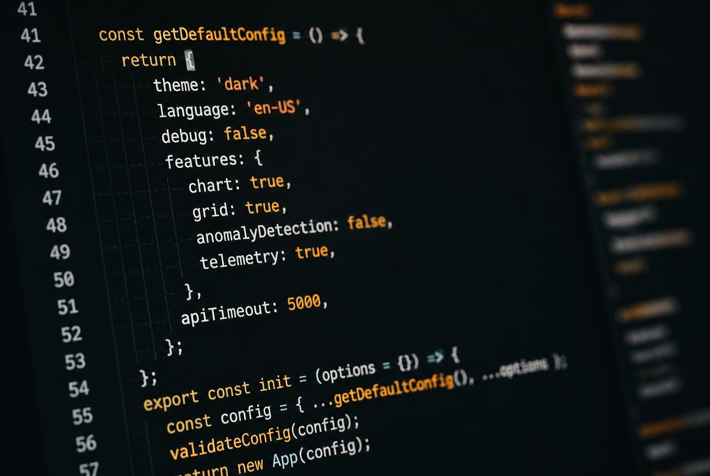 Close-up of application source code displayed on a dark editor screen
